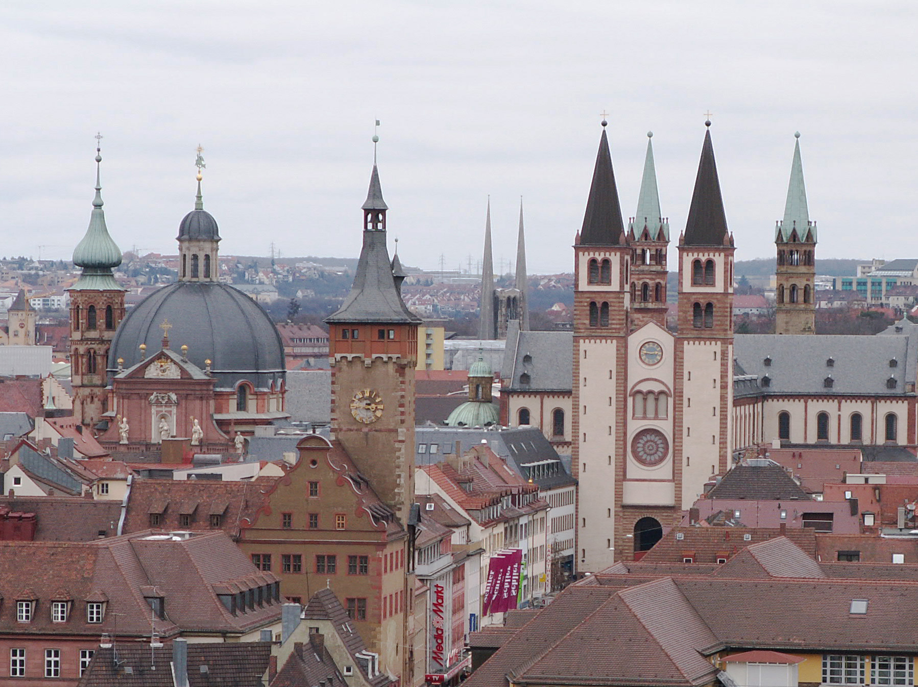 View of Würzburg's historic city center featuring multiple church steeples and red roofs